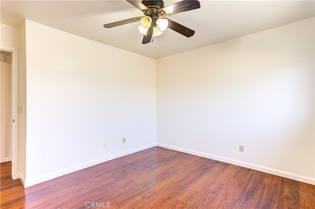 unfurnished room featuring dark hardwood / wood-style floors and ceiling fan