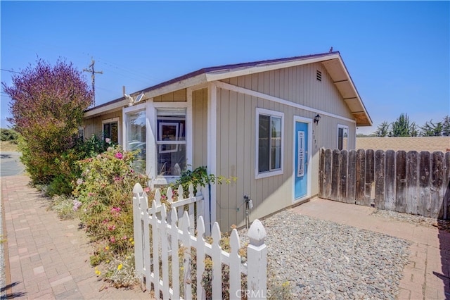 view of side of property with a patio