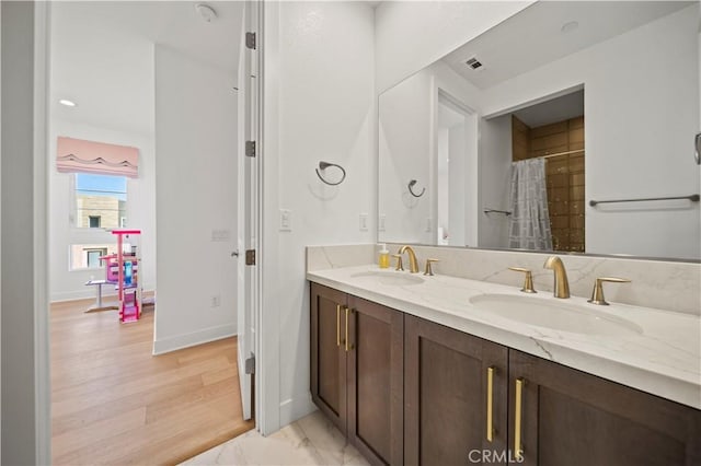 bathroom with vanity, wood-type flooring, and a shower with shower curtain