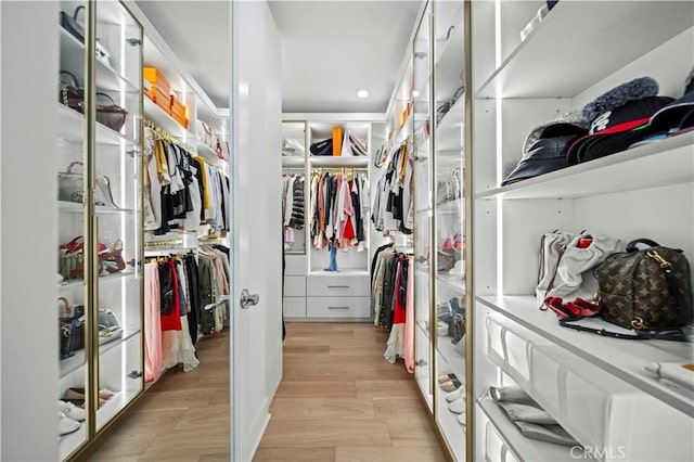 walk in closet featuring light wood-type flooring