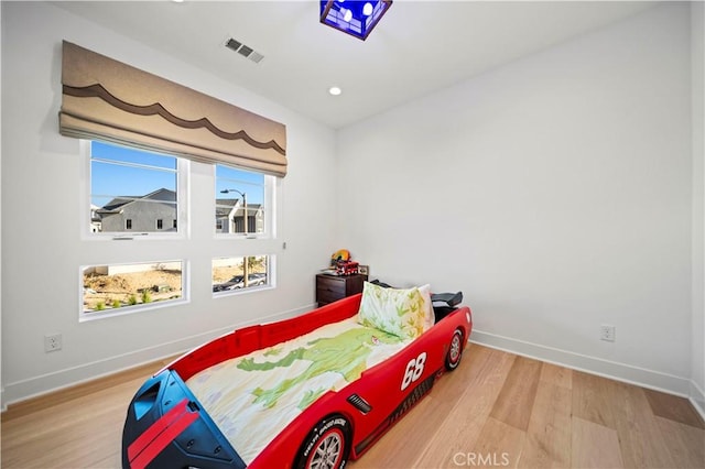 bedroom featuring hardwood / wood-style flooring