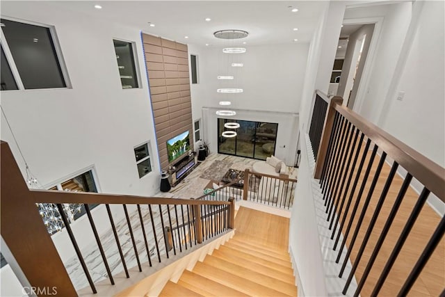 staircase with hardwood / wood-style flooring