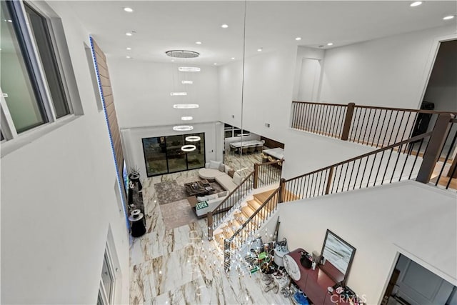 staircase with a towering ceiling