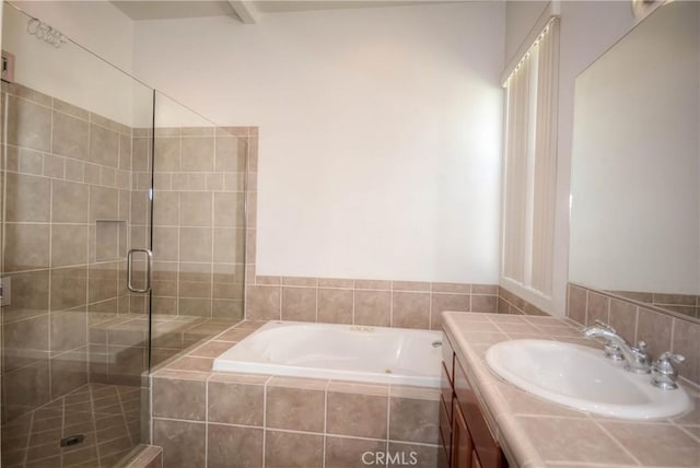 bathroom with vanity and independent shower and bath