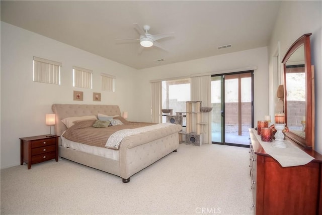 bedroom with access to outside, ceiling fan, and light colored carpet