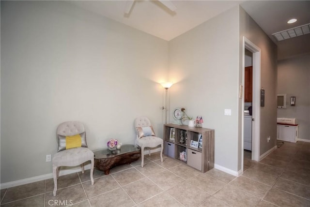 living area featuring light tile patterned floors