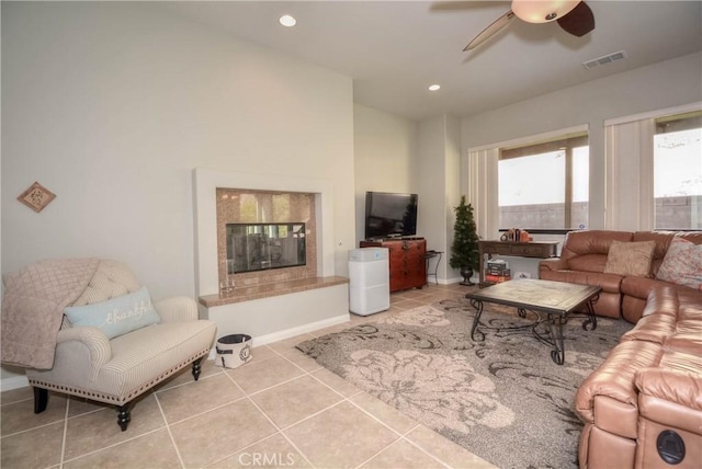 tiled living room featuring ceiling fan