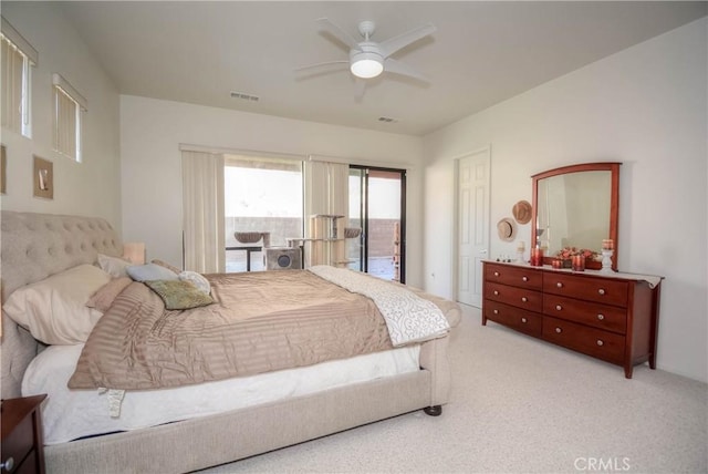 carpeted bedroom featuring access to exterior and ceiling fan