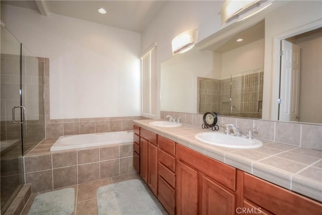 bathroom with tile patterned flooring, vanity, and independent shower and bath