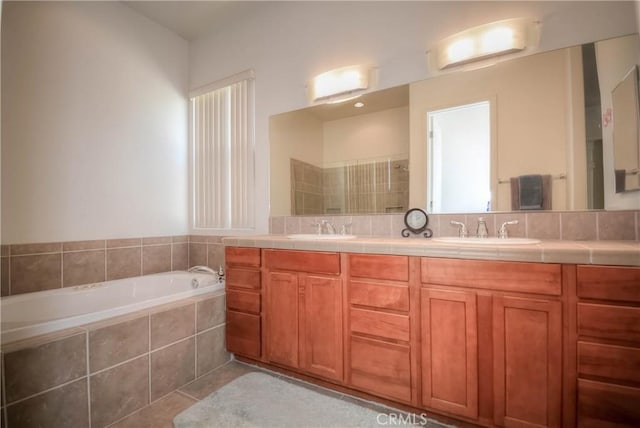 bathroom featuring tile patterned flooring, vanity, and independent shower and bath