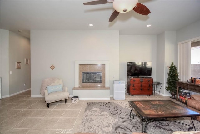 living room with ceiling fan and light tile patterned floors