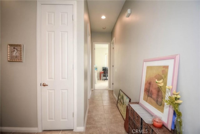 corridor featuring light tile patterned floors