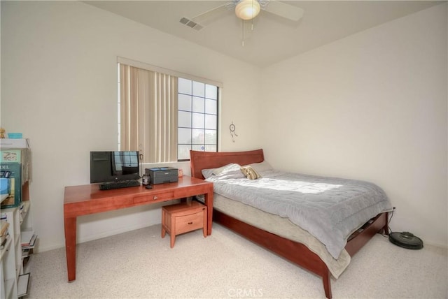 bedroom featuring ceiling fan and carpet