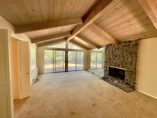 unfurnished living room featuring wooden ceiling, carpet, lofted ceiling with beams, and a fireplace