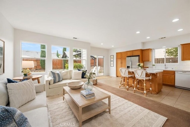 tiled living room featuring plenty of natural light