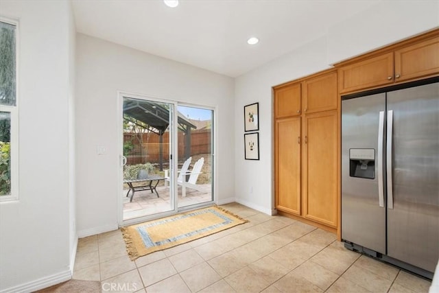 doorway to outside featuring light tile patterned floors