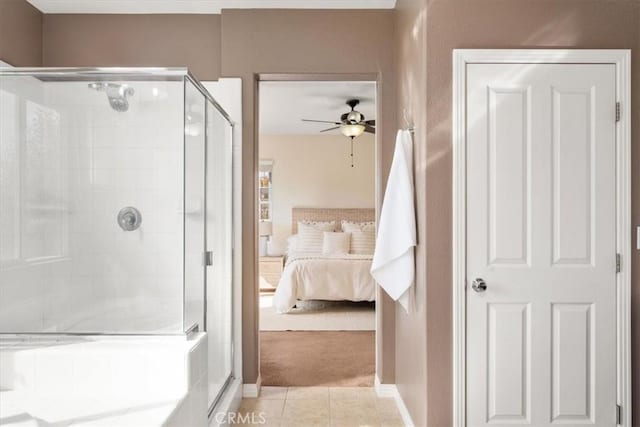 bathroom featuring tile patterned floors, ceiling fan, and a shower with shower door