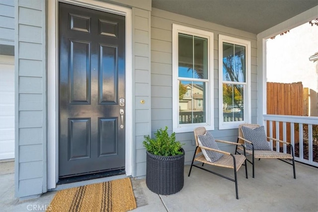 doorway to property featuring covered porch