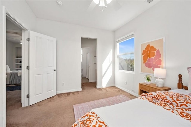 bedroom with ceiling fan and light carpet