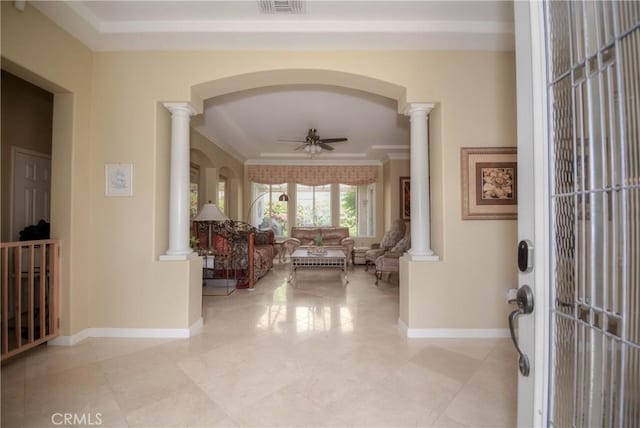 corridor featuring decorative columns and crown molding