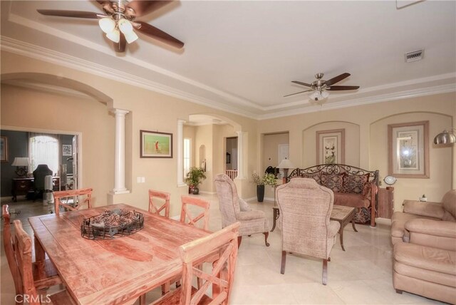 dining space with decorative columns, ceiling fan, and crown molding