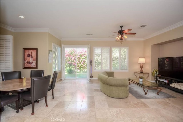 living room featuring ceiling fan and ornamental molding