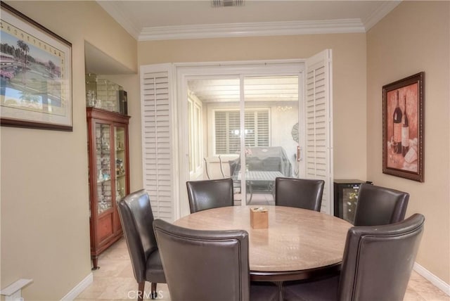 tiled dining space with crown molding