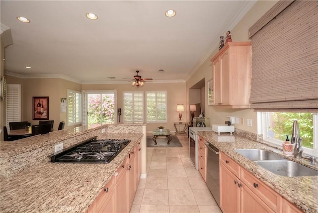 kitchen featuring a wealth of natural light, sink, dishwasher, black gas stovetop, and light brown cabinetry