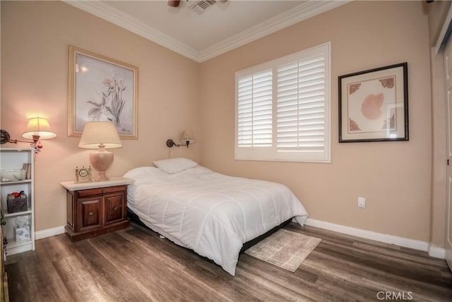 bedroom with crown molding and dark wood-type flooring