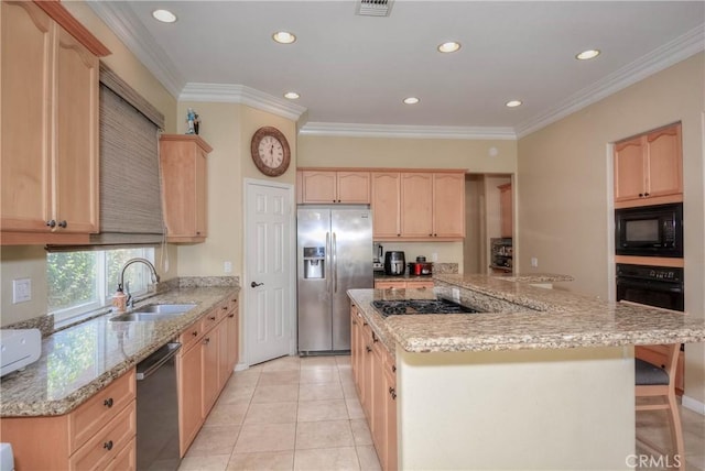 kitchen featuring light brown cabinetry, ornamental molding, sink, black appliances, and light tile patterned flooring