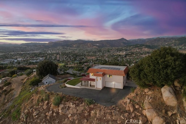 aerial view at dusk with a mountain view