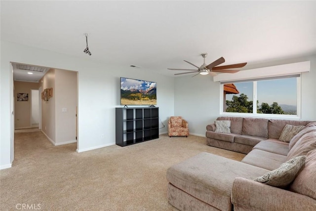 living room with ceiling fan and light colored carpet