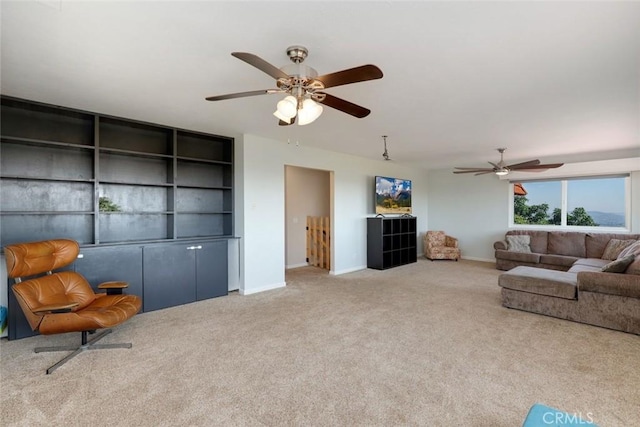 carpeted living room featuring ceiling fan