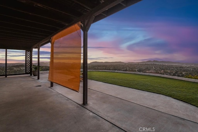 patio terrace at dusk with a mountain view