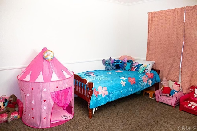 bedroom with dark colored carpet