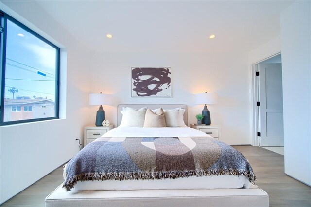 bedroom with light hardwood / wood-style floors