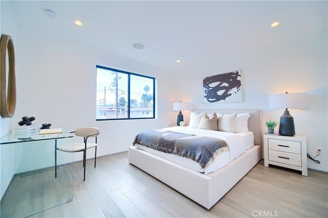 bedroom featuring light wood-style floors and recessed lighting