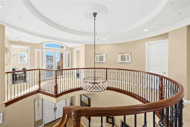 corridor featuring a tray ceiling