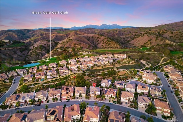 aerial view at dusk with a mountain view