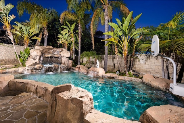 view of swimming pool featuring pool water feature