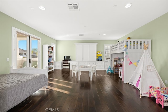 bedroom featuring dark wood-type flooring and access to exterior