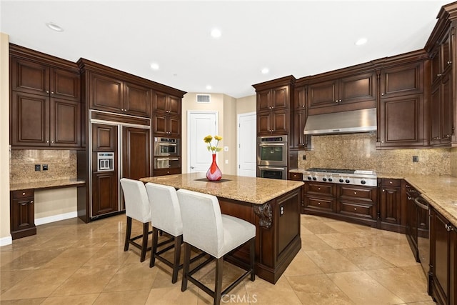 kitchen with backsplash, stainless steel appliances, a center island, and ventilation hood