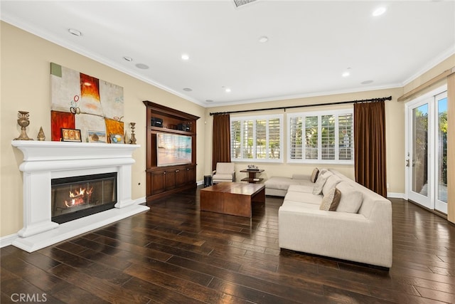 living room with ornamental molding and dark hardwood / wood-style floors