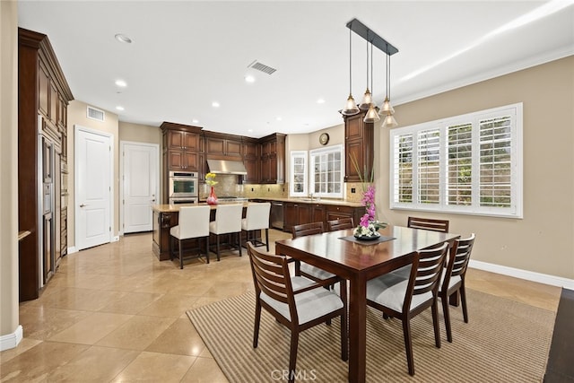 tiled dining area with sink