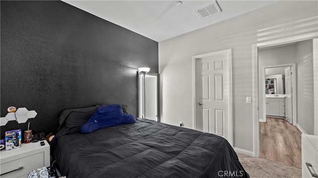 bedroom with light hardwood / wood-style flooring