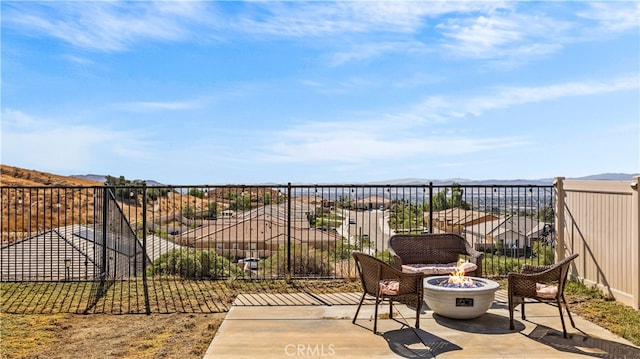 balcony featuring a patio and an outdoor fire pit