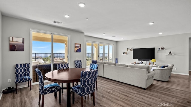 dining area featuring hardwood / wood-style flooring