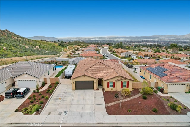 birds eye view of property featuring a mountain view