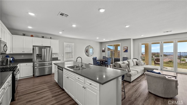 kitchen with sink, white cabinets, and stainless steel appliances