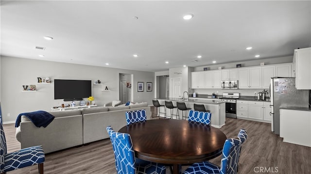 dining area featuring dark hardwood / wood-style floors